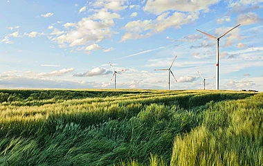 Beautiful shot of wind turbines under the cloudy sky in the Eiffel region, Germany
